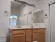 Bright bathroom featuring a double sink vanity with framed mirrors and lots of storage at 1970 W Park Pl, Chandler, AZ 85224