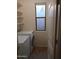 Functional laundry room equipped with a washer, dryer, and built-in shelving for storage at 1970 W Park Pl, Chandler, AZ 85224