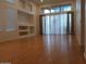 Large living room featuring light wood floors, high ceilings, large windows, and natural light at 1970 W Park Pl, Chandler, AZ 85224