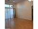 Bright living room featuring light wood floors, high ceilings, and natural light at 1970 W Park Pl, Chandler, AZ 85224
