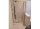 Bathroom with glass enclosed shower with built-in seat and tiled floor at 1970 W Park Pl, Chandler, AZ 85224