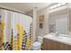 Bathroom featuring a shower, sink with vanity, decorative mirror, and modern finishes at 19700 N 76Th St # 1038, Scottsdale, AZ 85255