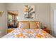 A cozy bedroom with a large window, stylish decor, and comfortable-looking bed at 19700 N 76Th St # 1038, Scottsdale, AZ 85255