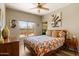 Cozy bedroom with a window showcasing the beautiful outdoor desert views, soft lighting and artwork at 19700 N 76Th St # 1038, Scottsdale, AZ 85255