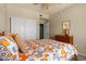 Bright bedroom with a comfortable bed, closet, ceiling fan, and neutral-toned walls at 19700 N 76Th St # 1038, Scottsdale, AZ 85255