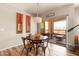 Charming dining area featuring a round table, stylish decor, and access to an outdoor patio at 19700 N 76Th St # 1038, Scottsdale, AZ 85255