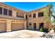 Charming townhome with a two-car garage and stone accents. Stairway entrance to the unit at 19700 N 76Th St # 1038, Scottsdale, AZ 85255