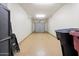 Spacious garage interior with a clean floor, overhead door, and ample storage space at 19700 N 76Th St # 1038, Scottsdale, AZ 85255