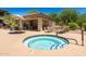 Inviting hot tub and nearby clubhouse with patio seating for relaxation at 19700 N 76Th St # 1038, Scottsdale, AZ 85255
