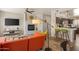 Open-concept living room with fireplace, modern furniture, and wood flooring at 19700 N 76Th St # 1038, Scottsdale, AZ 85255