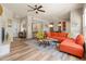 Bright living room boasts a fireplace, wood floors, and contemporary furnishings at 19700 N 76Th St # 1038, Scottsdale, AZ 85255