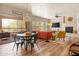 Open living area featuring a fireplace, comfortable furniture, and a bright dining space at 19700 N 76Th St # 1038, Scottsdale, AZ 85255