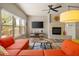 Spacious living room features a fireplace, desert views, and a ceiling fan at 19700 N 76Th St # 1038, Scottsdale, AZ 85255
