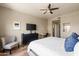 Comfortable main bedroom with a ceiling fan, natural light, and neutral color palette at 19700 N 76Th St # 1038, Scottsdale, AZ 85255