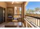 Outdoor patio featuring comfortable seating, a glass table, and desert views at 19700 N 76Th St # 1038, Scottsdale, AZ 85255
