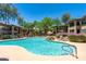 Large community pool with waterfall and ample seating, perfect for relaxing and socializing at 19700 N 76Th St # 1038, Scottsdale, AZ 85255