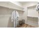 A walk-in closet with shelving, hanging space and a shoe rack for optimal storage solutions at 19700 N 76Th St # 1038, Scottsdale, AZ 85255