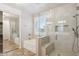 Beautiful bathroom with tiled floors, shower, soaker tub, and modern finishes at 20226 N Madison Dr, Maricopa, AZ 85138