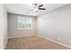 Neutral bedroom with plush carpet, ceiling fan, and natural light at 20226 N Madison Dr, Maricopa, AZ 85138