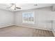 Bedroom featuring neutral walls, neutral carpet, ceiling fan, and windows with wooden shutters at 20226 N Madison Dr, Maricopa, AZ 85138
