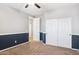 Carpeted bedroom with an ensuite and a closet at 20226 N Madison Dr, Maricopa, AZ 85138