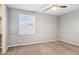 Neutral bedroom with carpet, window and walk-in closet at 20226 N Madison Dr, Maricopa, AZ 85138