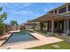 Enjoy outdoor living with a refreshing backyard pool and landscaped surroundings at 20226 N Madison Dr, Maricopa, AZ 85138