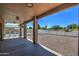Covered patio with view of fenced yard and private pool at 20911 E Excelsior Ave, Queen Creek, AZ 85142