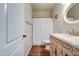 Bright bathroom featuring single sink vanity and a shower/tub combo with curtain at 20911 E Excelsior Ave, Queen Creek, AZ 85142