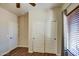 This secondary bedroom features a closet and a single window at 20911 E Excelsior Ave, Queen Creek, AZ 85142
