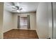 This secondary bedroom features a single window and hardwood floors at 20911 E Excelsior Ave, Queen Creek, AZ 85142