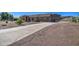 Beautiful single-story home featuring desert landscaping, a tile roof, and a long concrete driveway at 20911 E Excelsior Ave, Queen Creek, AZ 85142