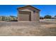 Exterior of detached garage surrounded by gravel landscaping at 20911 E Excelsior Ave, Queen Creek, AZ 85142
