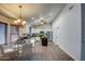 Open kitchen and dining area with hardwood floors and modern lighting at 20911 E Excelsior Ave, Queen Creek, AZ 85142