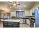 Bright kitchen with stainless steel appliances, an island, and ample cabinet space at 20911 E Excelsior Ave, Queen Creek, AZ 85142