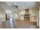 Spacious living room with fireplace and hardwood floors; open concept design at 20911 E Excelsior Ave, Queen Creek, AZ 85142