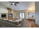 Cozy living room with fireplace, modern decor, and view to dining area at 20911 E Excelsior Ave, Queen Creek, AZ 85142