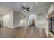Open-concept living space with hardwood floors, archways, and fireplace at 20911 E Excelsior Ave, Queen Creek, AZ 85142