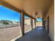 Covered patio with ceiling lights and a view of the spacious backyard at 20911 E Excelsior Ave, Queen Creek, AZ 85142