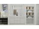 Elegant bathroom with dual sink vanity, neutral color palette, and open shelving for organized storage at 20913 S 231St Way, Queen Creek, AZ 85142