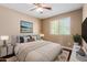 Comfortable bedroom with bright natural light, neutral walls, and stylish furnishings at 21136 N 36Th Pl, Phoenix, AZ 85050