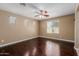 Large bedroom with wood flooring, ceiling fan, and natural light at 21136 N 36Th Pl, Phoenix, AZ 85050