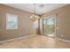 Dining room with chandelier and sliding door to patio at 21136 N 36Th Pl, Phoenix, AZ 85050