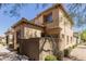 Rear exterior view of the home featuring desert landscaping and a block wall fence at 21136 N 36Th Pl, Phoenix, AZ 85050