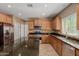 Bright kitchen features wood cabinets, granite countertops, stainless steel appliances, and center island at 21136 N 36Th Pl, Phoenix, AZ 85050
