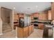 Spacious kitchen featuring granite countertops, stainless steel appliances, and a large center island at 21136 N 36Th Pl, Phoenix, AZ 85050