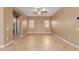 Open living room with neutral paint, tile flooring, and natural light at 21136 N 36Th Pl, Phoenix, AZ 85050