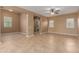 Spacious living room with neutral colors, tile flooring, and ceiling fan at 21136 N 36Th Pl, Phoenix, AZ 85050