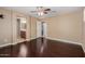 Main bedroom with wood floors, access to bathroom, and ceiling fan at 21136 N 36Th Pl, Phoenix, AZ 85050
