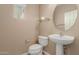 Powder room features a pedestal sink and modern fixtures at 21136 N 36Th Pl, Phoenix, AZ 85050
